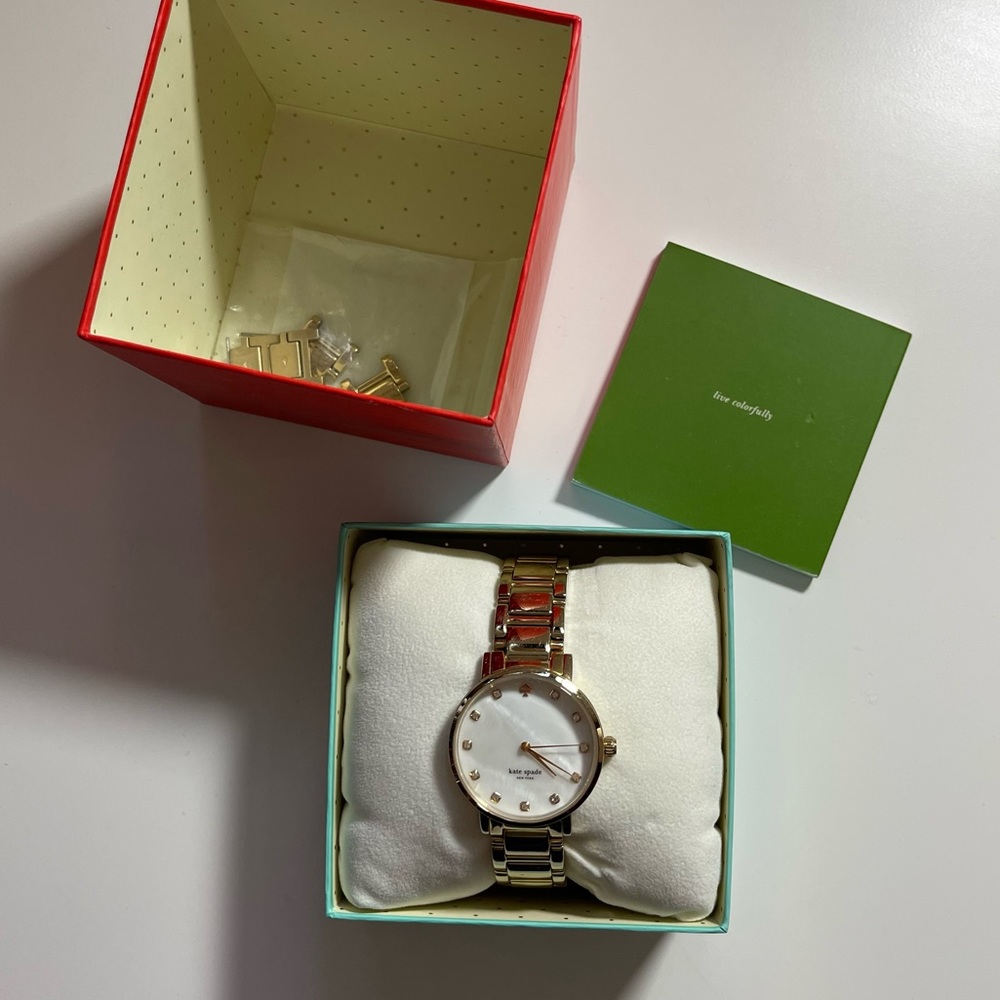 gold Kate Spade watch with opal face